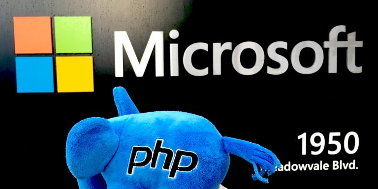 The PHP elephpant looking at a Microsoft sign